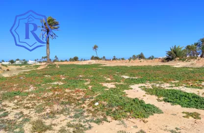 Terrain en montée à Mezraya disposant d'une vue mer à pieds titre bleu