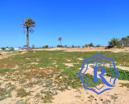 Terrain en montée à Mezraya disposant d'une vue mer à pieds titre bleu image-1